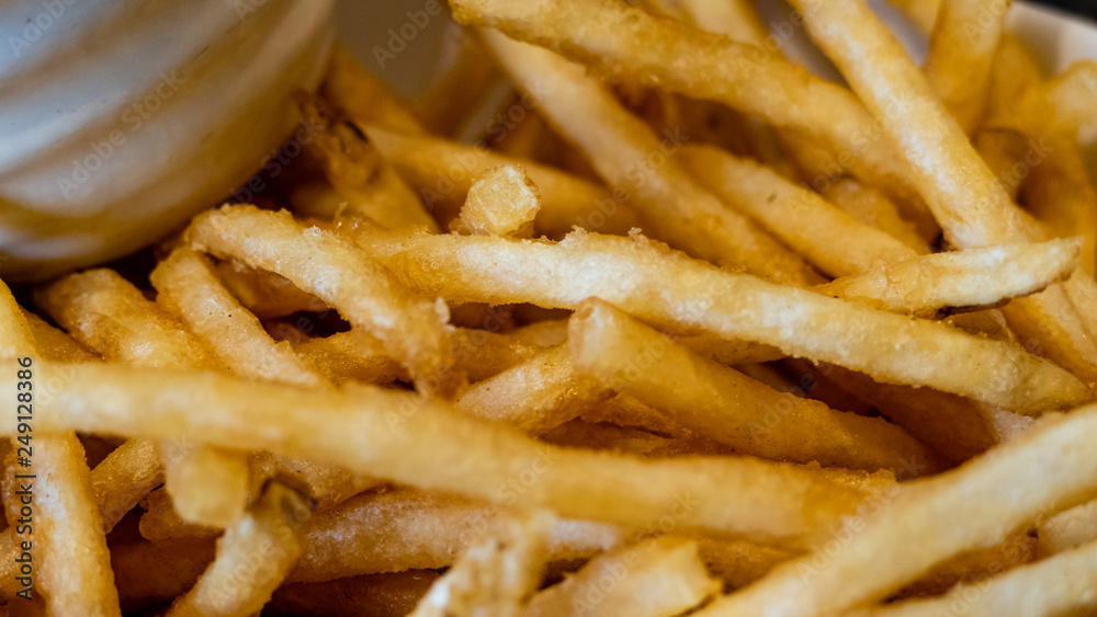 French fries in white bowl with ketchup side French fries in white bowl with ketchup side