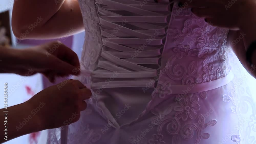 Bride Wears a Wedding Dress in Hotel Room. Bride Wears a Wedding Dress in Hotel Room.