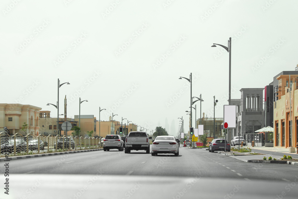 City traffic on sunny day, view from car