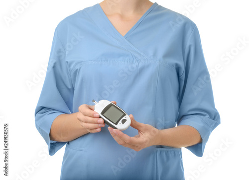 Female doctor holding glucose meter on white background, closeup. Medical object