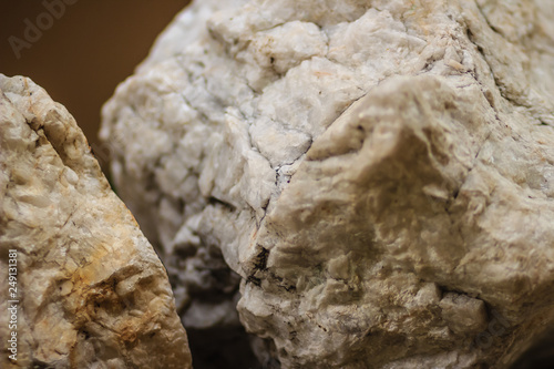 Raw specimen of Barite stone from mining and quarrying. Baryte or barite (BaSO4) is a mineral consisting of barium sulfate. Baryte is generally white or colorless, and is the main source of barium. photo