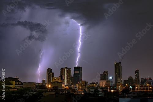 Thunderstorm Lightning Over City Skyline at Night in Bangkok, Asia