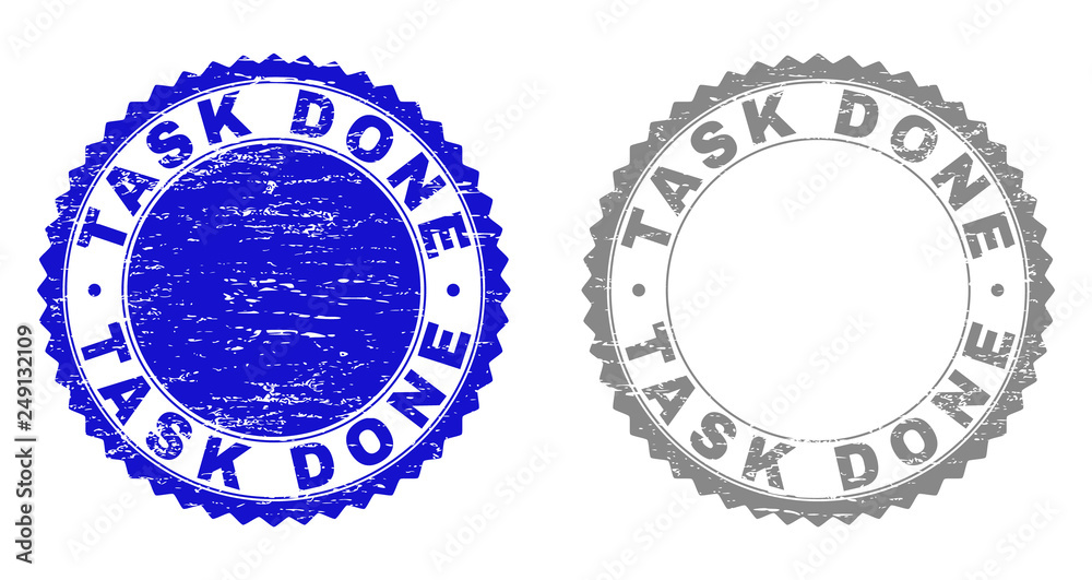 Grunge TASK DONE stamp seals isolated on a white background. Rosette seals with grunge texture in blue and gray colors. Vector rubber stamp imitation of TASK DONE title inside round rosette.
