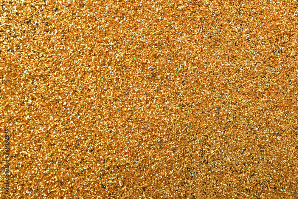 Texture of gold glitter as background, closeup