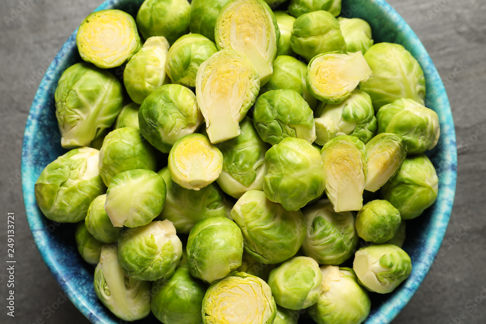 Bowl with fresh Brussels sprouts on table, top view Bowl with fresh Brussels sprouts on table, top view