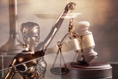 Wooden judge gavel on blurred background close-up view