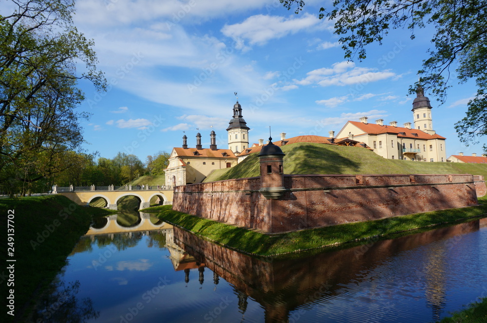 Nesvizh Castle on a sunny day. Nyasvizh, Nieśwież, Nesvizh, Niasvizh, Nesvyzhius, Nieświeżh, in Minsk Region, Belarus. Site of residential castle of the Radziwill family. 