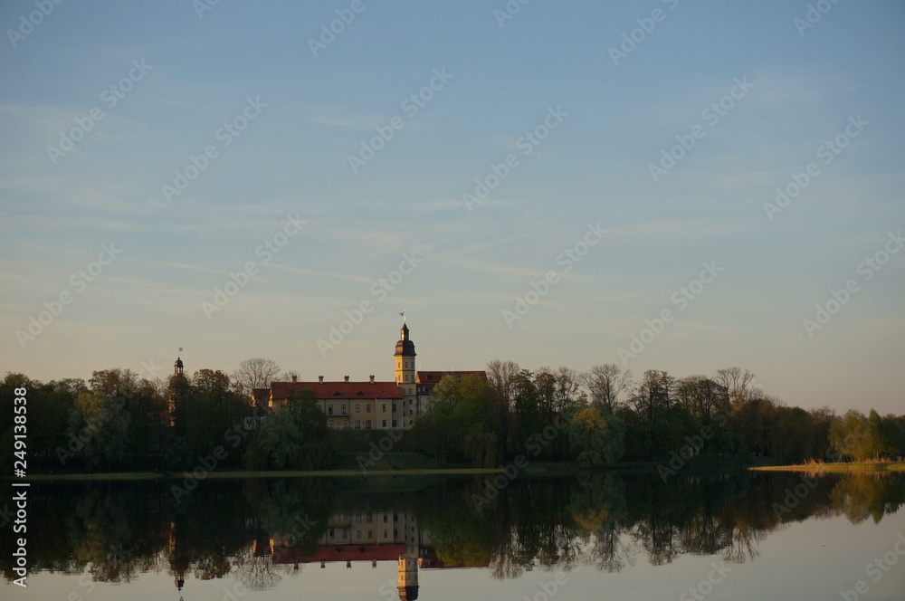 Nesvizh Castle in autumn as seen from across the pond. Minsk Region, Belarus. Site of residential castle of the Radziwill family. 