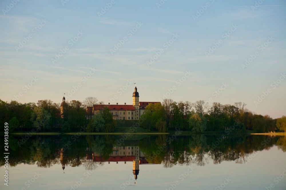 Nesvizh Castle in autumn as seen from across the pond. Minsk Region, Belarus. Site of residential castle of the Radziwill family. 