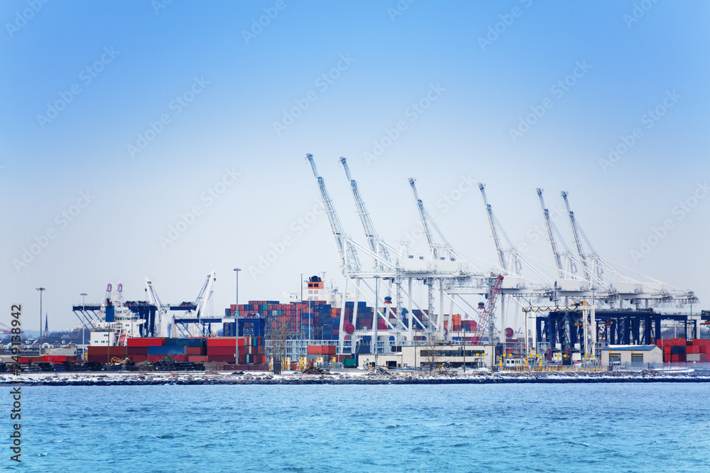 Marine cranes and containers at maritime port