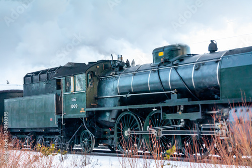 KOUVOLA, FINLAND - DECEMBER 26, 2018: Steam train Ukko-Pekka going from Kouvola to Kotka. The steam locomotive Hr1 1009 was made in 1948 and restored in 1993