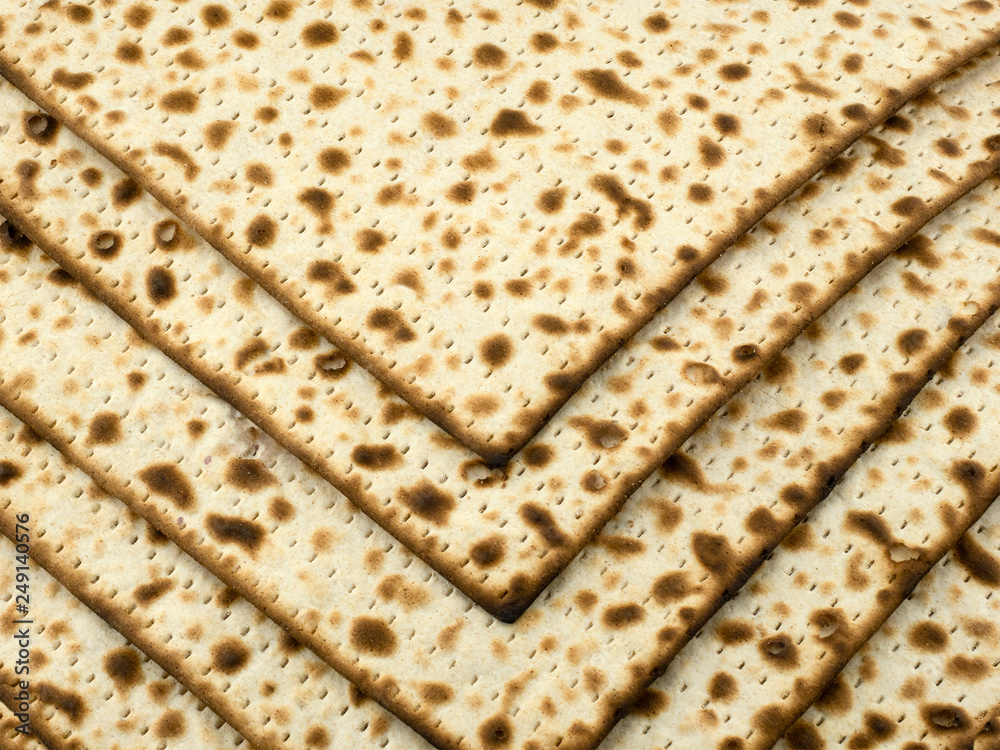 An open pack of baked matzo is laid out on the table.. Copy space.