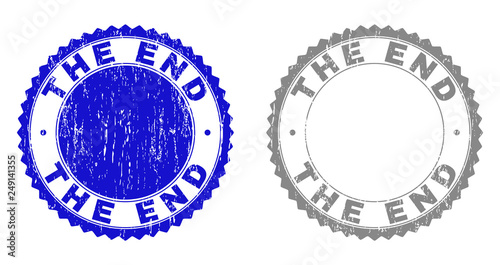 Grunge THE END stamp seals isolated on a white background. Rosette seals with grunge texture in blue and grey colors. Vector rubber overlay of THE END caption inside round rosette.