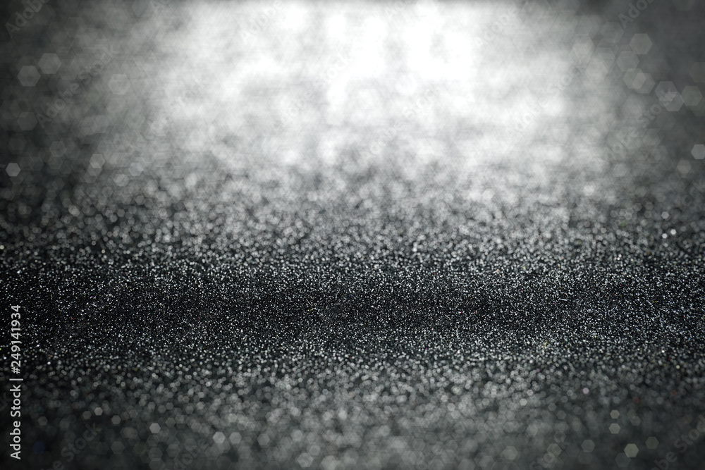 Abstract black glitter lights background with surface texture focused Abstract black glitter lights background with surface texture focused