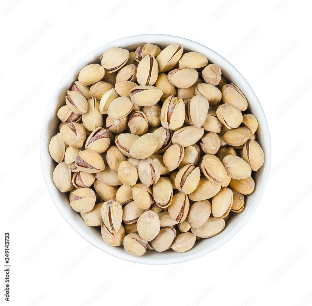 pistachios in a plate on white background pistachios in a plate on white background