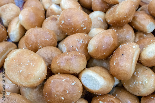 Lots of garlic buns. Background from round bakery products.