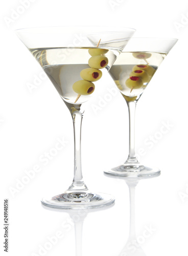 Two classic dry martini with olives isolated on white background