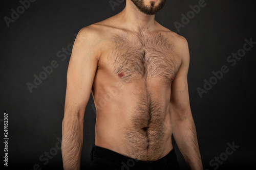 Close up portrait of young man withbare naked torso photo