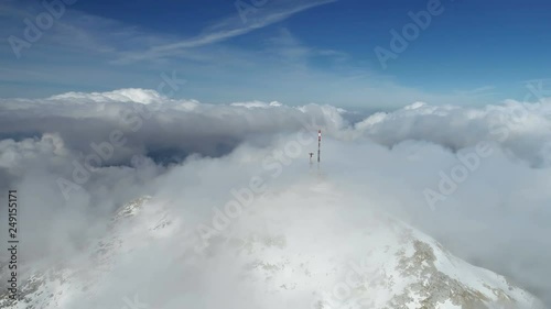 Stunning mountain winter landscape of Stirovnik peak with telecommunication tower, the highest summit of the Lovcen National Park. photo