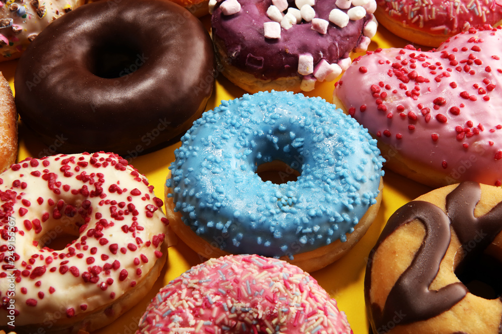 assorted donuts with chocolate frosted, pink glazed and sprinkles donuts assorted donuts with chocolate frosted, pink glazed and sprinkles donuts