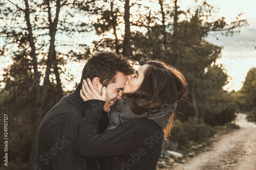 Couple of guy and girl hugged and happy in the field.Photo style social networks and vintage