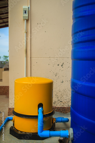 House water supply system in the housing estate that composed with yellow automatic water pump.