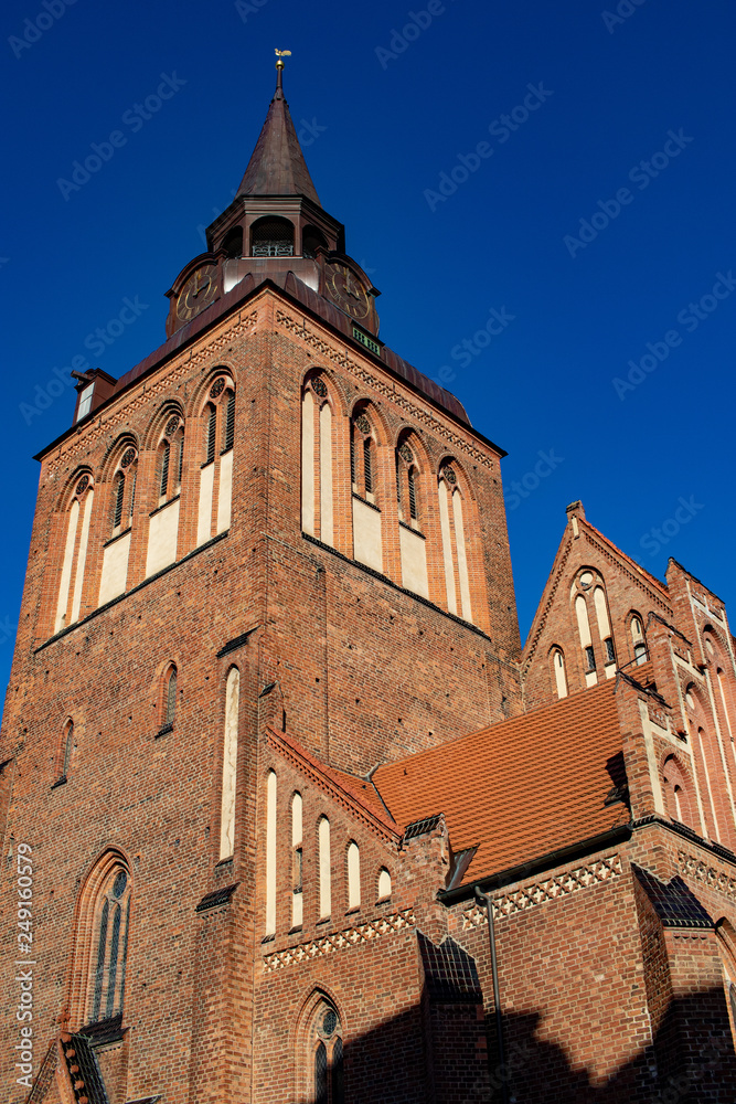 Big church tower in front of blue sky in germany
