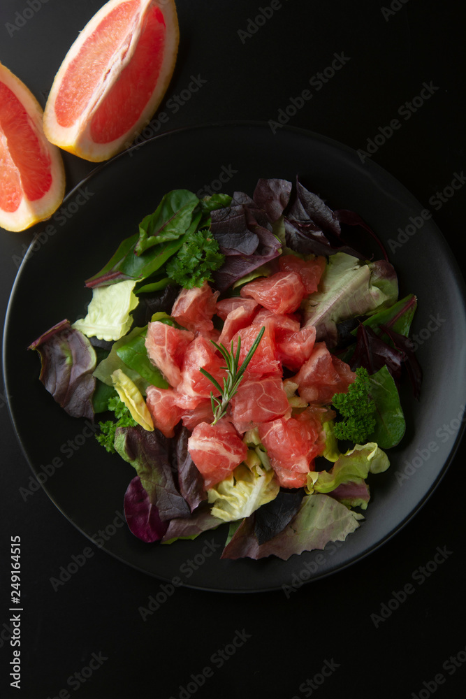 Healthy salad grapefruit and green leaves. Deliciouse dietary food. lose weigh. Healthy salad grapefruit and green leaves. Deliciouse dietary food. lose weigh.