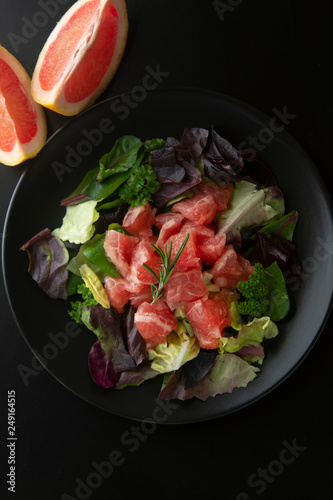 Healthy salad grapefruit and green leaves. Deliciouse dietary food. lose weigh.