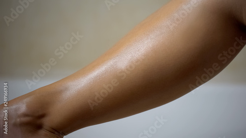 Shaved leg close up, beautiful smooth moisturized skin, depilation and bodycare