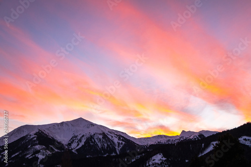 View from Hohentauern to sunset over snowy winter mountain Lackneralm photo