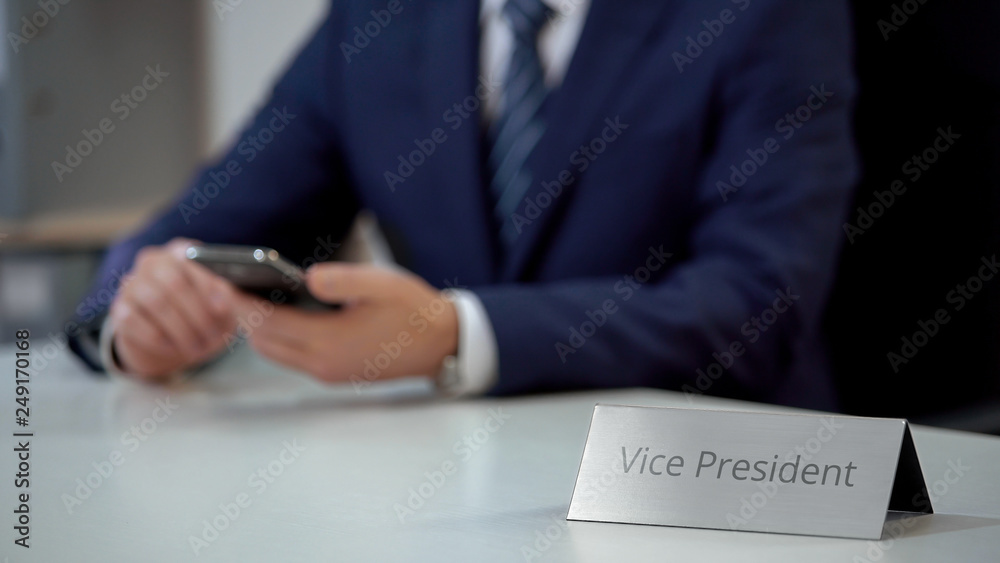 Professional vice president of company using smartphone for communication Professional vice president of company using smartphone for communication