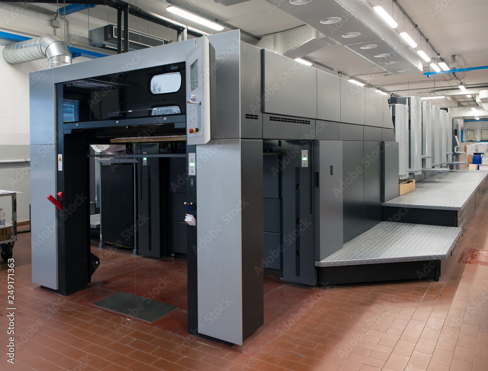 Press printing - Offset machine. Printing technique where the inked image is transferred from a plate to a rubber blanket, then to the printing surface.