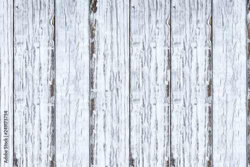 Bright white distressed wooden texture backdrop. Image shot from overhead view.