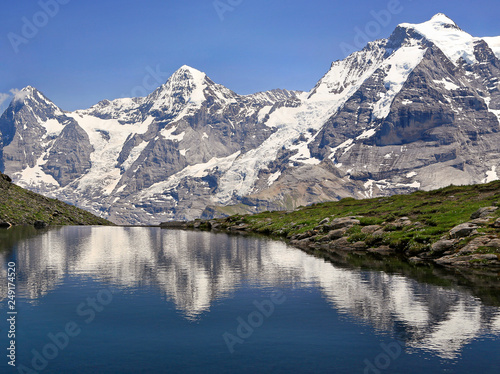 Eiger  Monch and Jungfrau mountains reflected in Grauseewli Lake  Switzerland Alps
