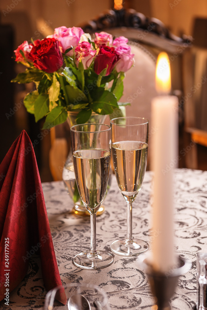 valentines day background with roses and champagne in hotel or restaurant, romantic evening 