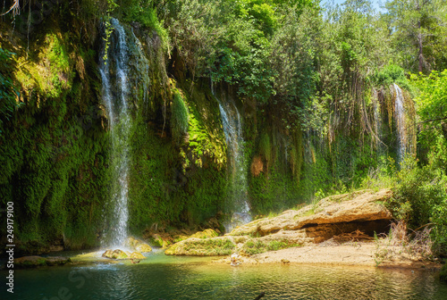 Fototapeta Naklejka Na Ścianę i Meble -  Jungle beautiful waterfall Mountain river stream - Landscape waterfall front of the cave green forest nature plant tree rainforest with rock stone