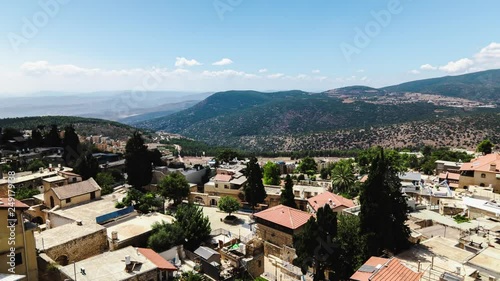 Pan shot of beautiful mountain landscape with passing clouds, time lapse. View from the top, Upper Galilee, Safed, Israel. photo