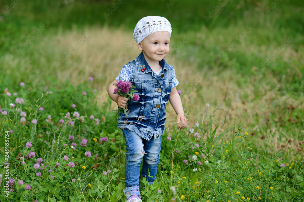 Cute baby girl with spring flowers Cute baby girl with spring flowers