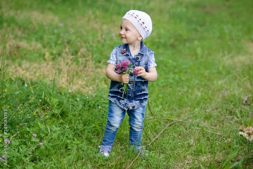 Cute baby girl with spring flowers Cute baby girl with spring flowers