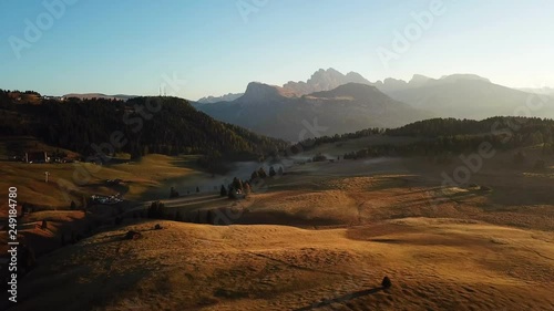 Aerial misty sunrise scenery at Alpe di Siusi, Dolomite Alps, Italy. photo