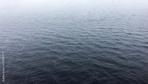 water surface in the fog. small ripples on the water. background