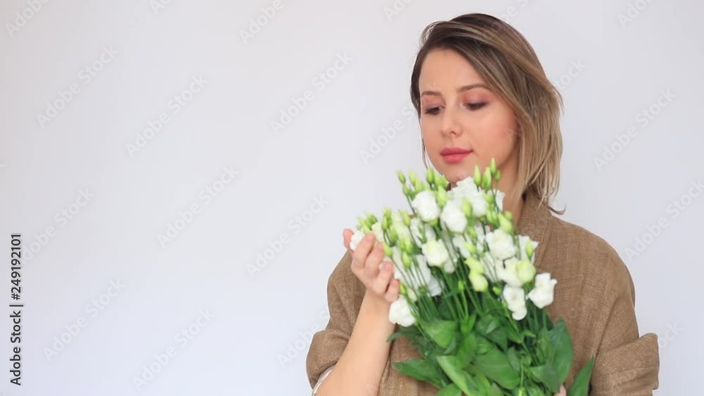 Beautiful girl with white fresh roses on white background. Beautiful girl with white fresh roses on white background.