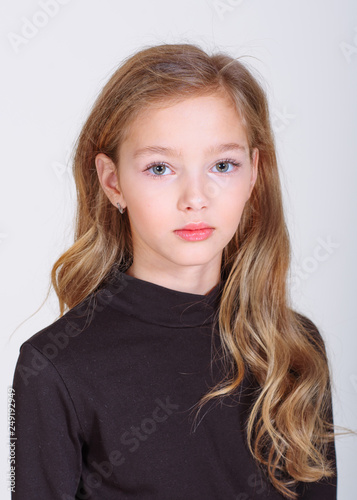 portrait of little model girl in studio
