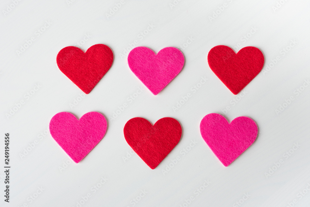 White Saint Valentine's day background with red and pink hearts, copy space White Saint Valentine's day background with red and pink hearts, copy space