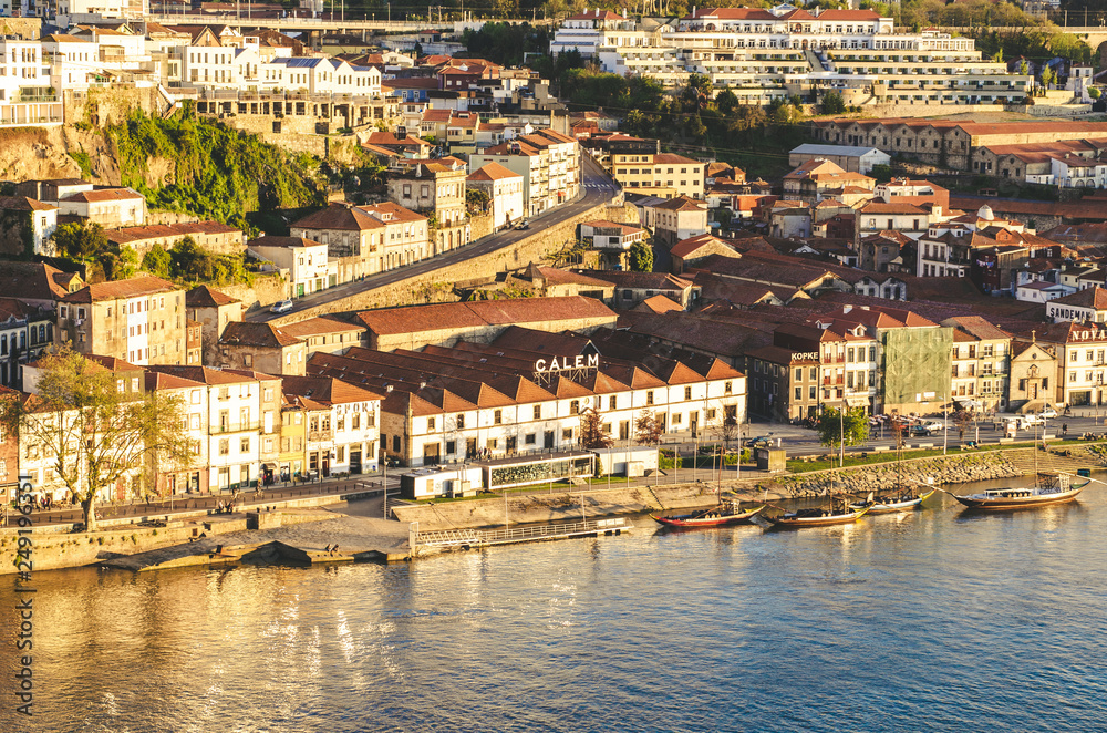 28 April - Porto, Portugal: beautiful Porto cityscape with red roofs and river while sunset