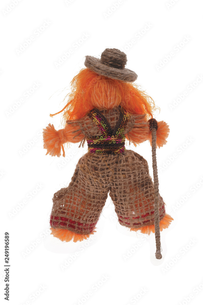 Figurine of a red-haired guy with a cane in wide trousers and a hat, handmade from jute thread isolated on a white background 02.