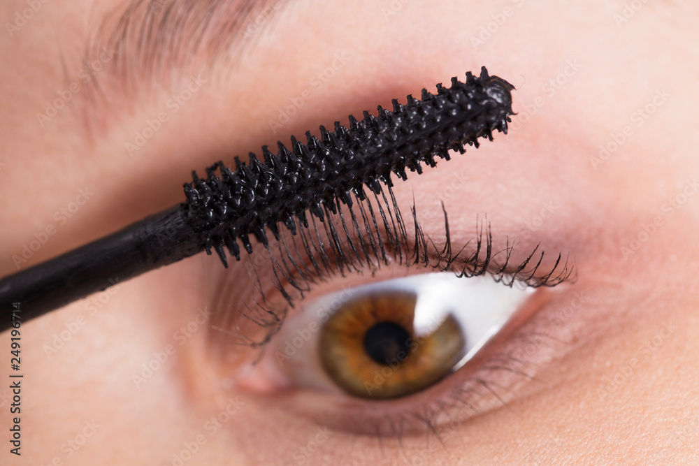 Applying mascara closeup