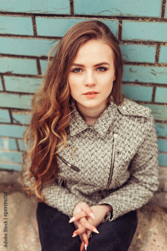 Close up portrait of young sad depressed girl outdoors. Casual, natural beauty, sadness concept Close up portrait of young sad depressed girl outdoors. Casual, natural beauty, sadness concept