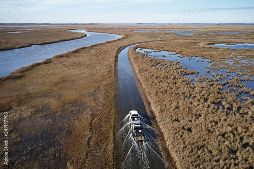 USA, Maryland, Cambridge, High tide flooding from rising sea levels at Blackwater National Wildlife Refuge photo